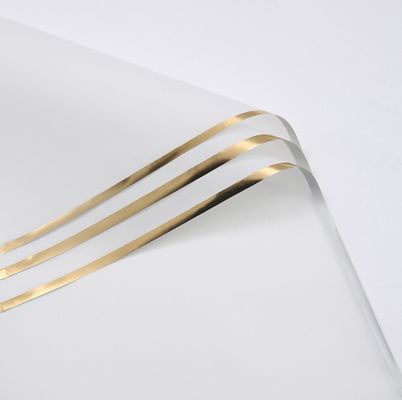 İyi bir fiyat. Altın kenarlı jelli film çiçek sarma kağıdı 58*58cm Yarım şeffaf Nakliye süresi Buket ambalajı malzemesi için 30-45 gün çevrimiçi